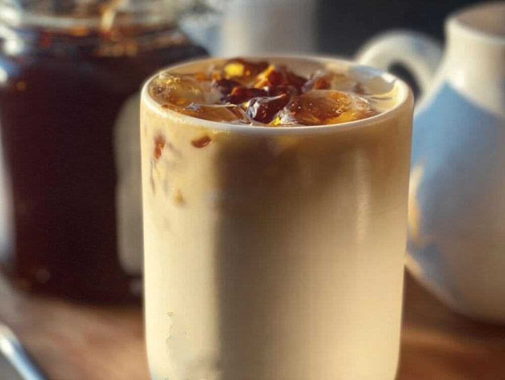 Classic Dutch Bros Golden Eagle Coffee served in a cozy cup, showcasing creamy layers and caramel drizzle.