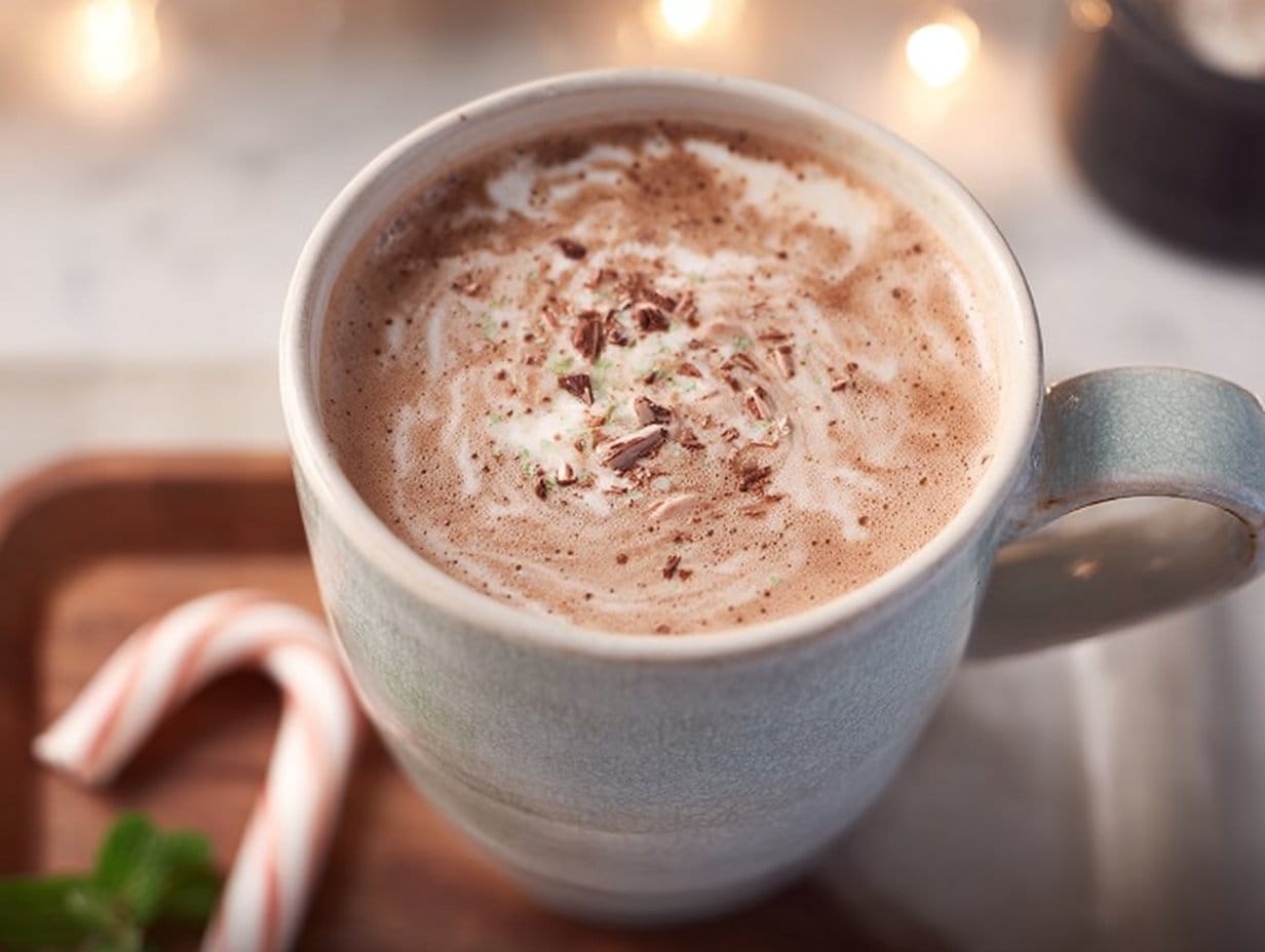 A delicious Healthy Peppermint Mocha topped with whipped cream made with almond milk and brewed coffee.