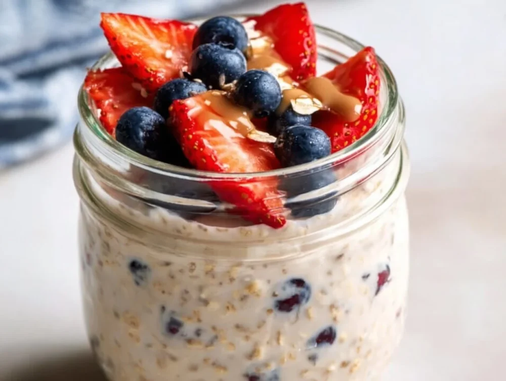 High-protein cottage cheese overnight oats topped with fruits and nuts.