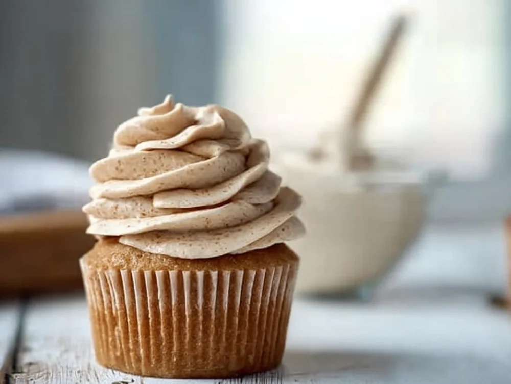 Brown Sugar Ermine Frosting spread on a vanilla cake slice